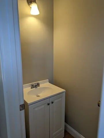 a bathroom with a sink and vanity