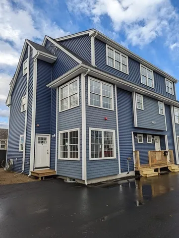 a front view of a house with garage