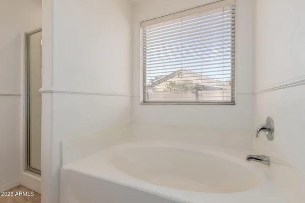 a white bath tub sitting next to a window