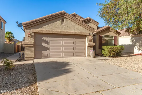 a front view of a house with a garage