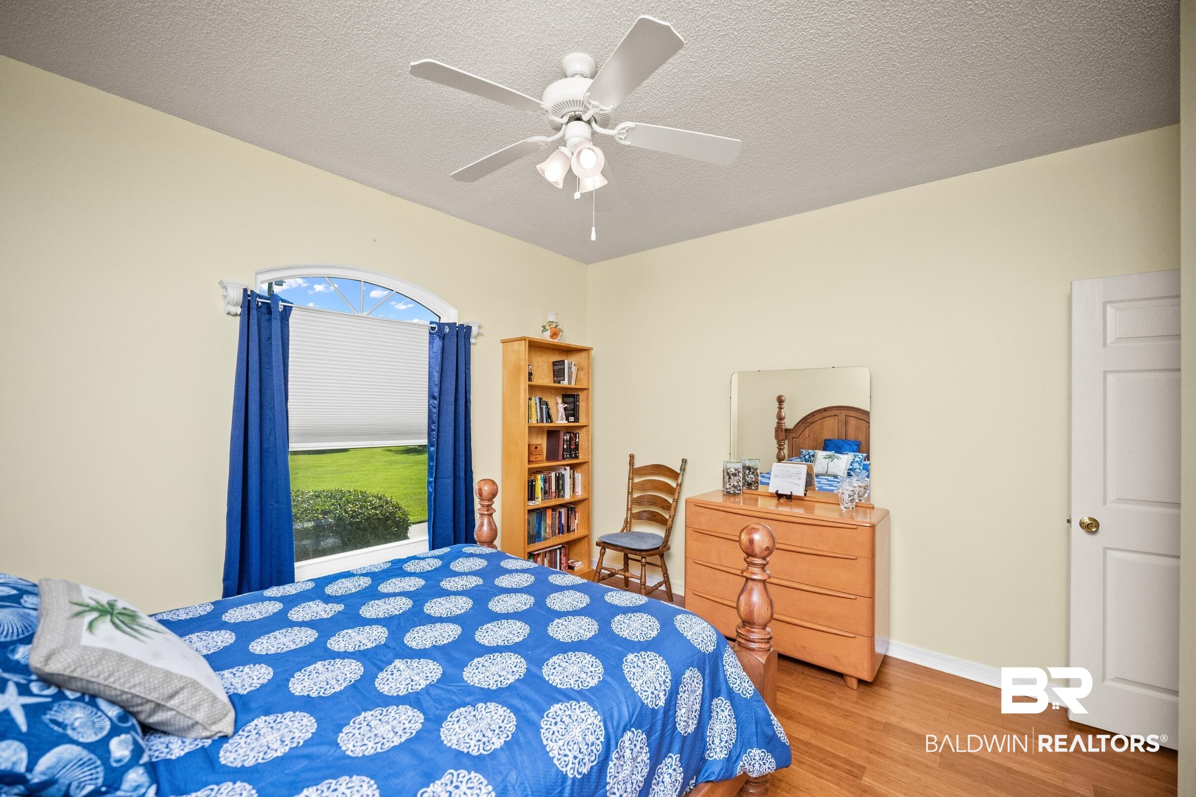 22355 East County Road 12 Foley, AL 36535 - Photo 36 of 54 Bedroom featuring wood finished floors, ceiling fan, and a textured ceiling