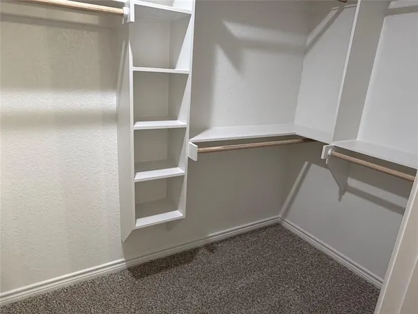 a view of an empty walk in closet