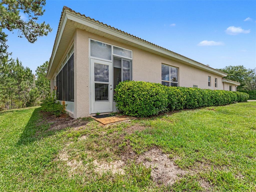 8910 Jericho Road Weeki Wachee, FL 34613 - Photo 47 of 52 a front view of a house with garden