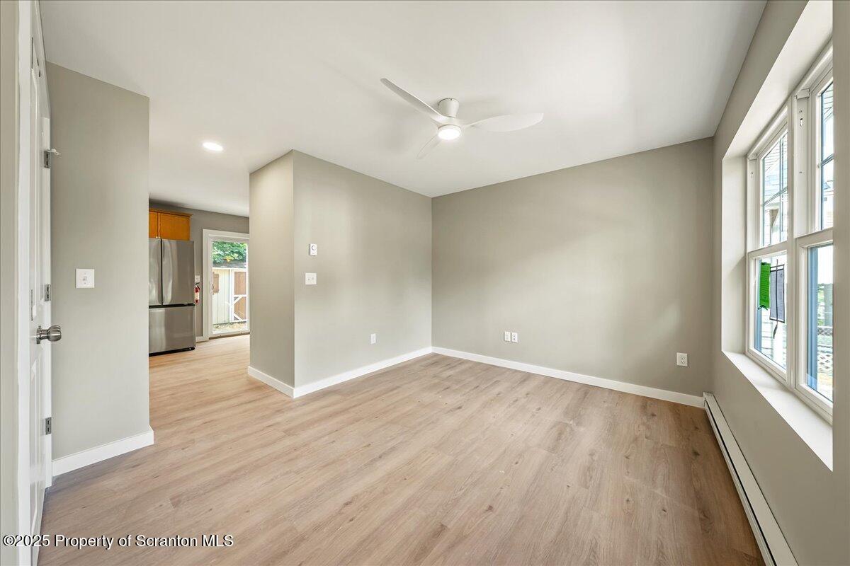 820 822 Delaware Street Scranton, PA 18509 - Photo 19 of 48 wooden floor in an empty room with a window