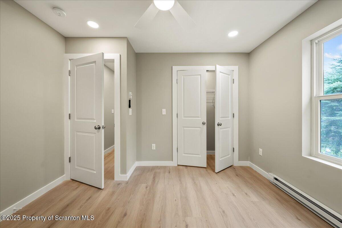 820 822 Delaware Street Scranton, PA 18509 - Photo 25 of 48 wooden floor in an empty room with a window