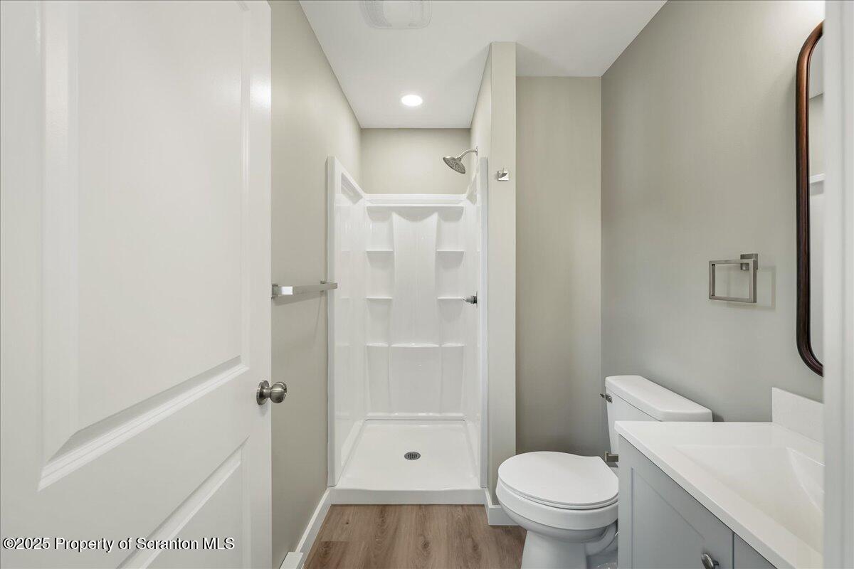 820 822 Delaware Street Scranton, PA 18509 - Photo 27 of 48 a bathroom with a granite countertop toilet a sink and shower