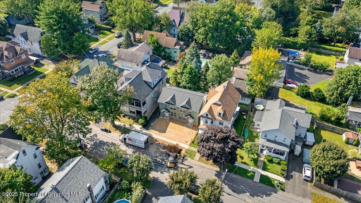 820 822 Delaware Street Scranton, PA 18509 - Photo 35 of 48 an aerial view of a house with a yard and outdoor seating