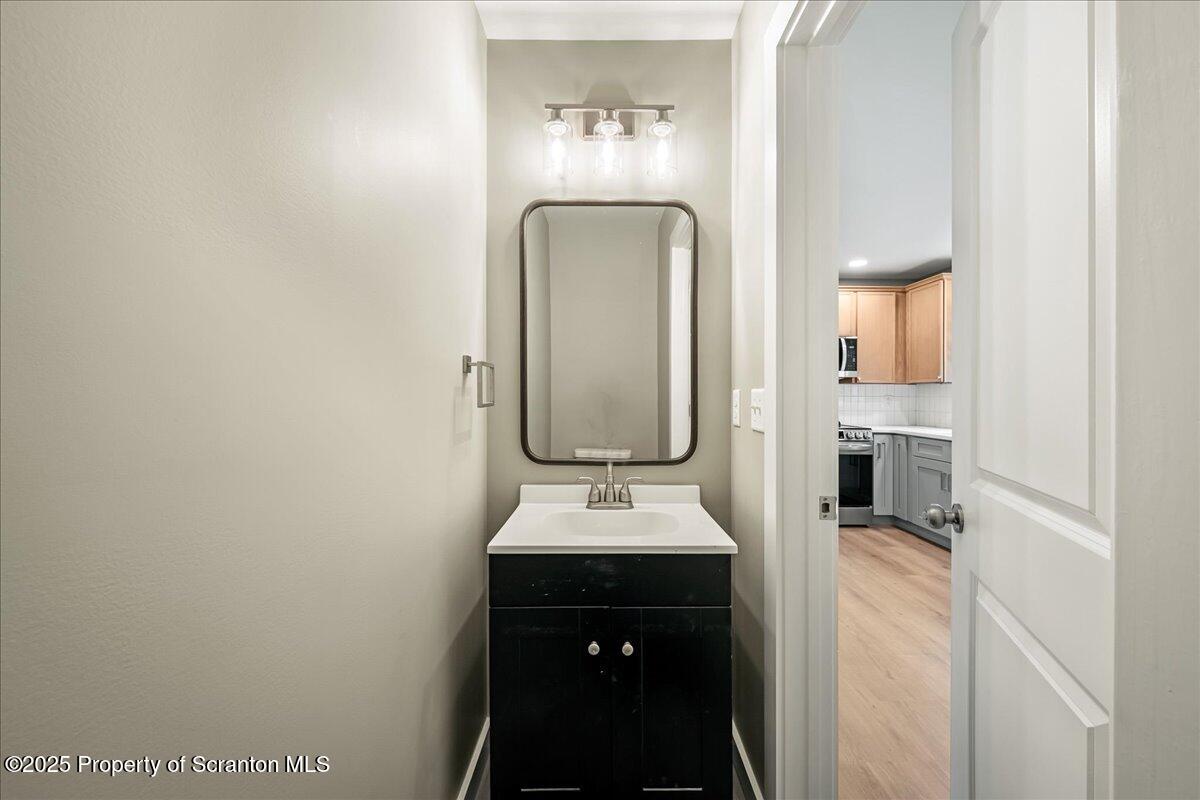 820 822 Delaware Street Scranton, PA 18509 - Photo 6 of 48 a bathroom with a sink and a mirror