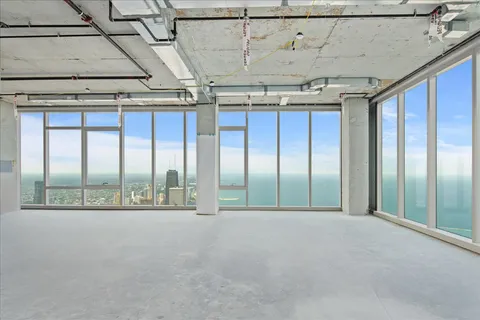 a view of a room with stainless steel appliances and cabinets