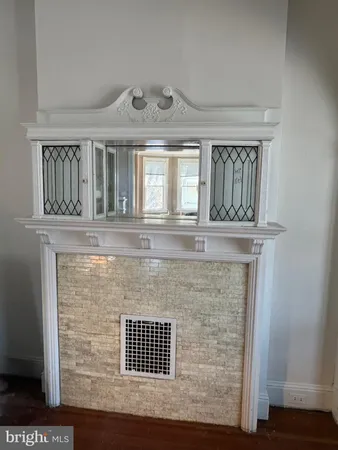 a view of fireplace with wooden floor