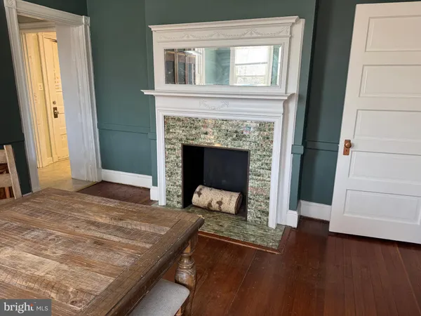 a living room with a fireplace and a fireplace