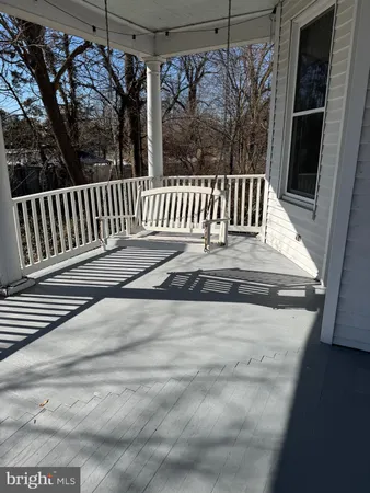 a view of deck with a flat screen tv