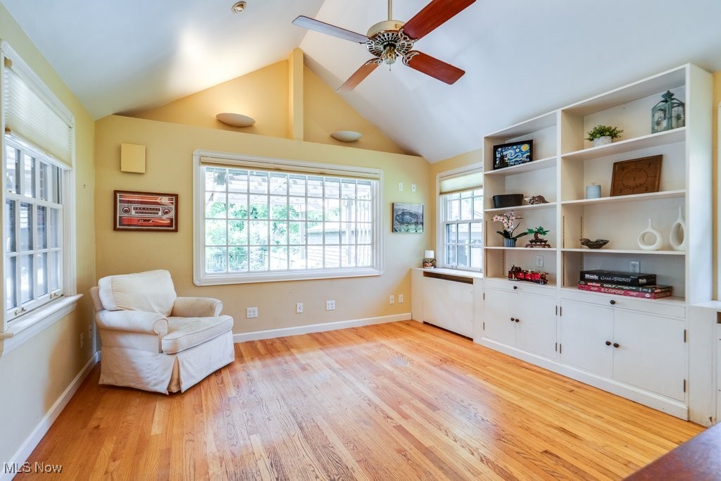 2500 Eaton Road Cleveland, OH 44118 - Photo 27 of 50 Sitting room featuring light wood-style floors, a ceiling fan, vaulted ceiling, and baseboards