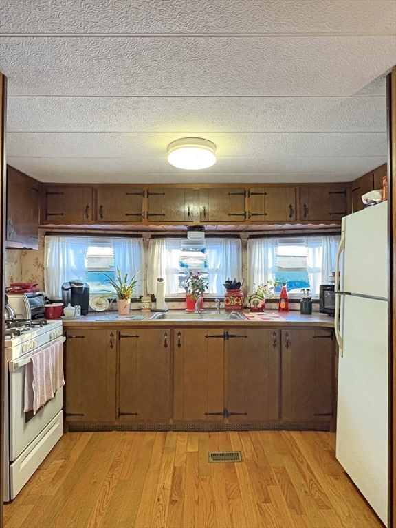 9 King Drive Wareham, MA 02576 - Photo 6 of 12 a kitchen with lots of counter top space and stainless steel appliances