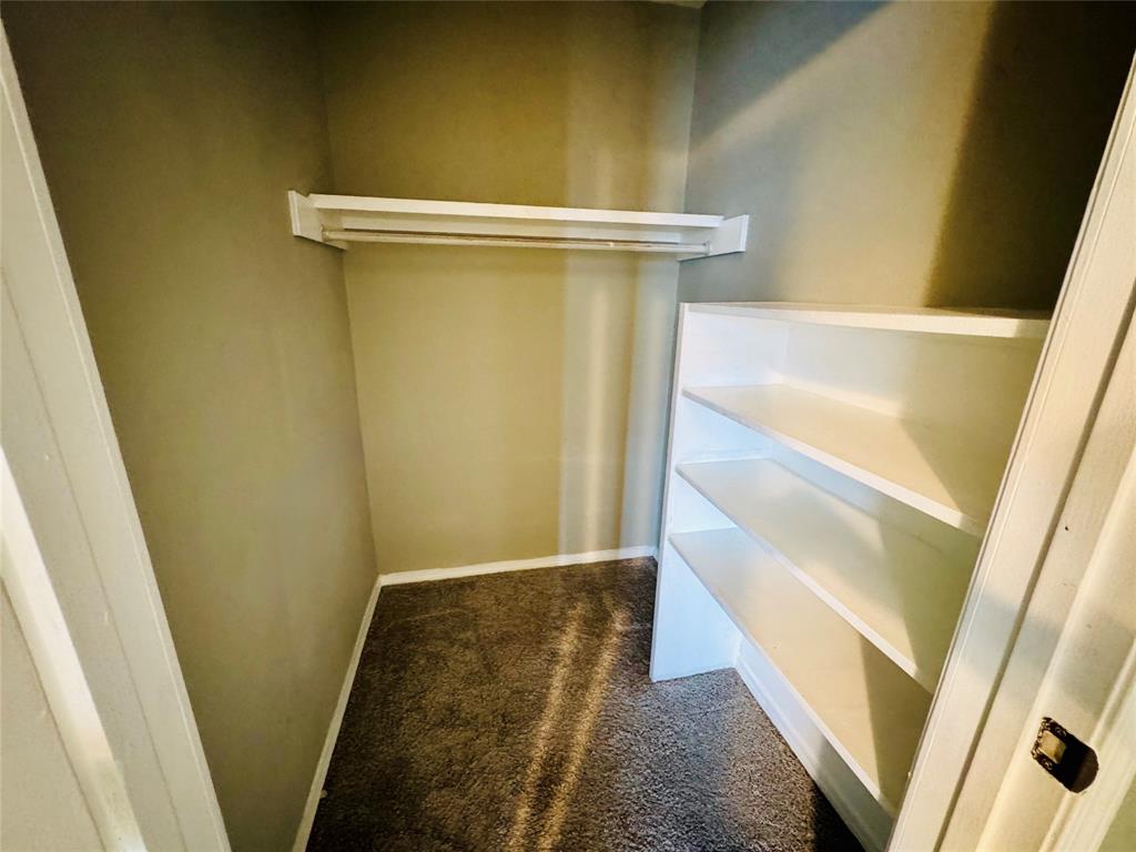 1712 Smokehouse Road Granbury, TX 76049 - Photo 14 of 25 Bedroom closet with lots of storage