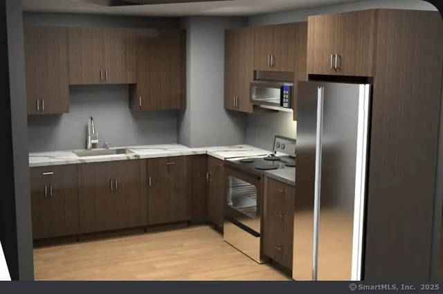 a kitchen with stainless steel appliances granite countertop a refrigerator a stove and a sink