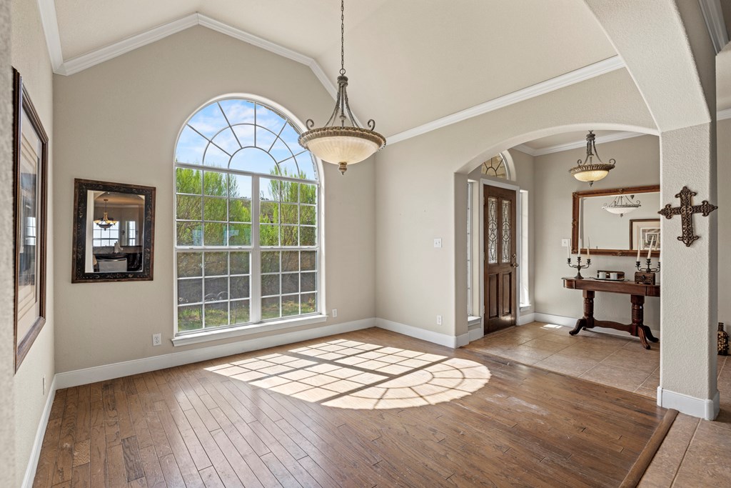 2250 Otte Road Stonewall, TX 78671 - Photo 6 of 35 a view of a livingroom with wooden floor and a window