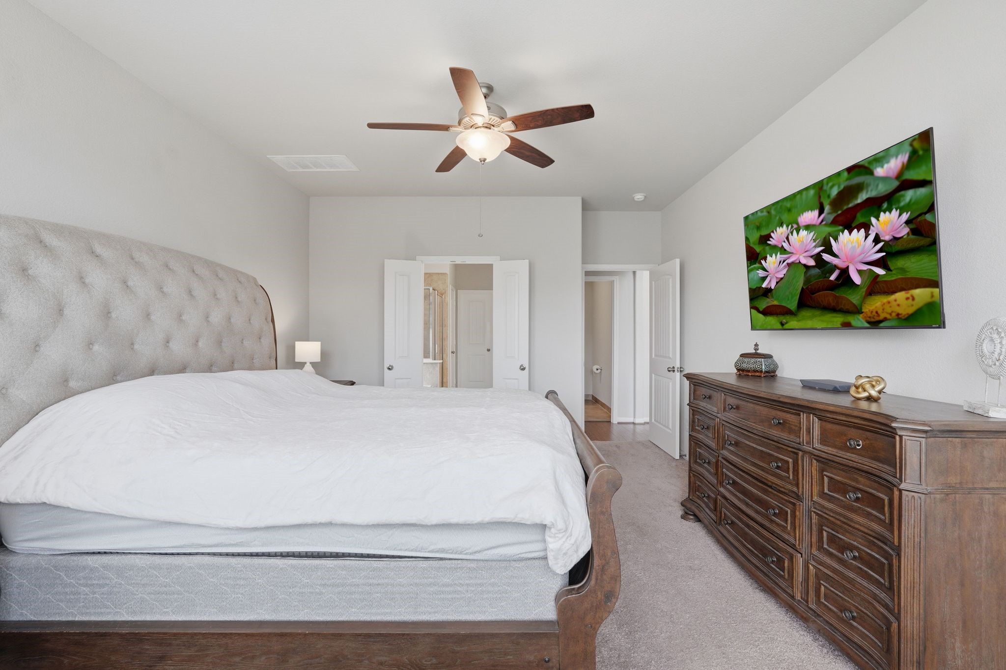 7522 Windsor View Drive Spring, TX 77379 - Photo 24 of 49 Bright primary bedroom with easy access to the ensuite bath.