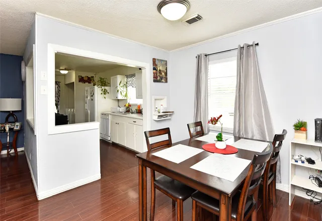 a view of a dining room with furniture and window