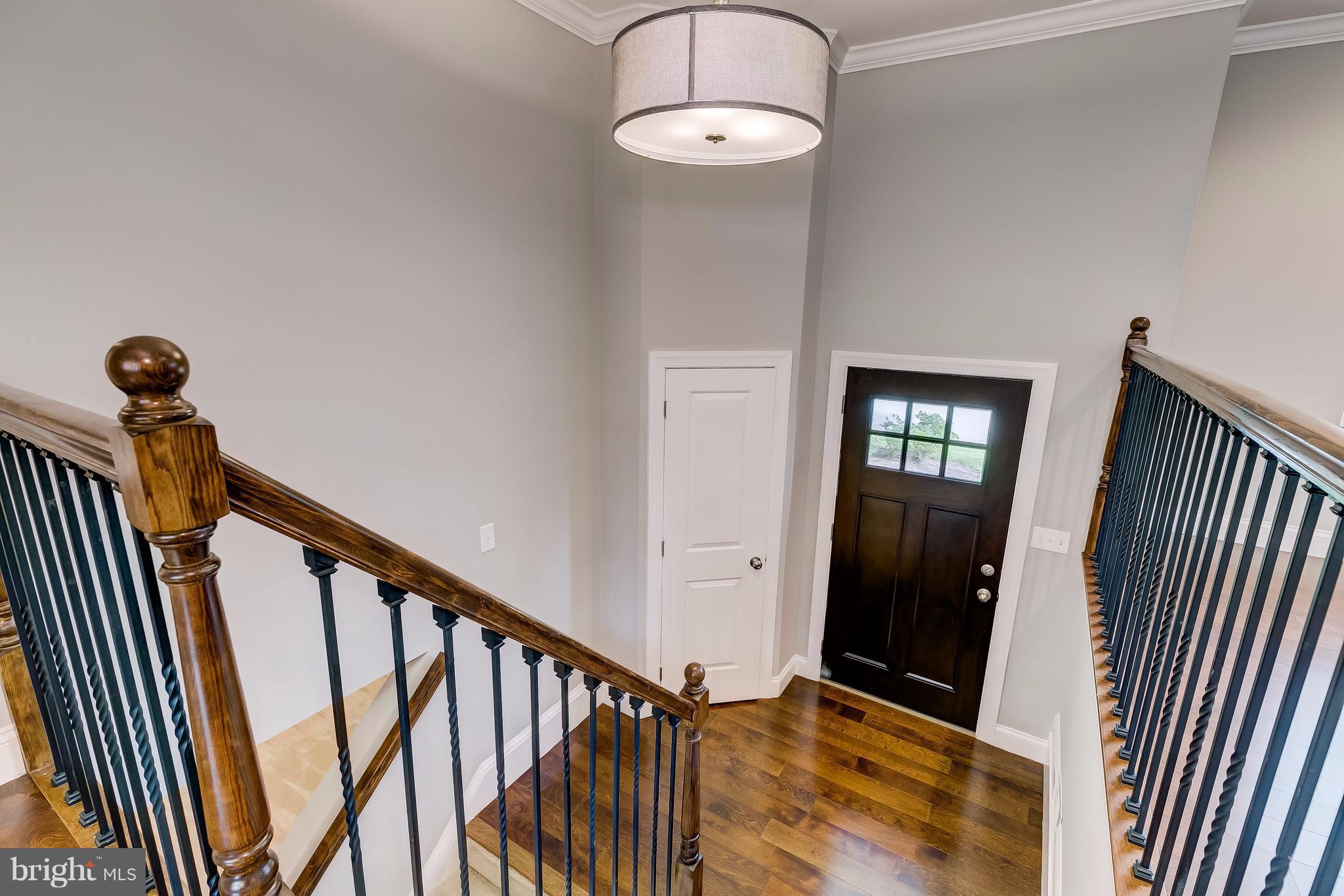 625 Edwards Road Annapolis, MD 21409 - Photo 17 of 30 a view of a hallway with wooden floor and staircase