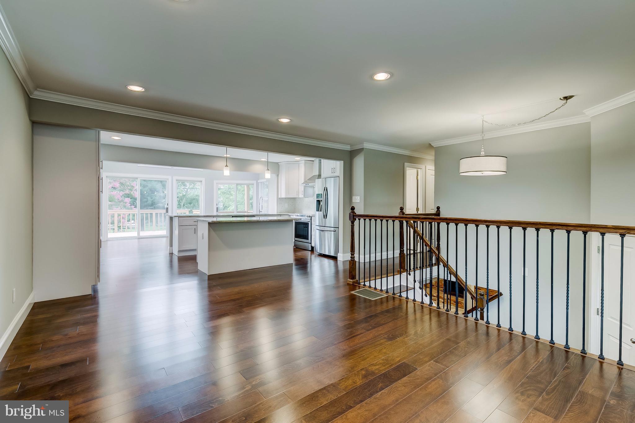 625 Edwards Road Annapolis, MD 21409 - Photo 3 of 30 an empty room with wooden floor and windows