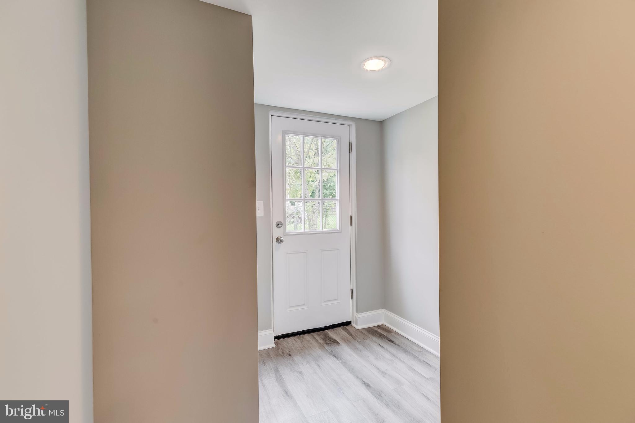625 Edwards Road Annapolis, MD 21409 - Photo 23 of 30 a view of an empty room with wooden floor and a window