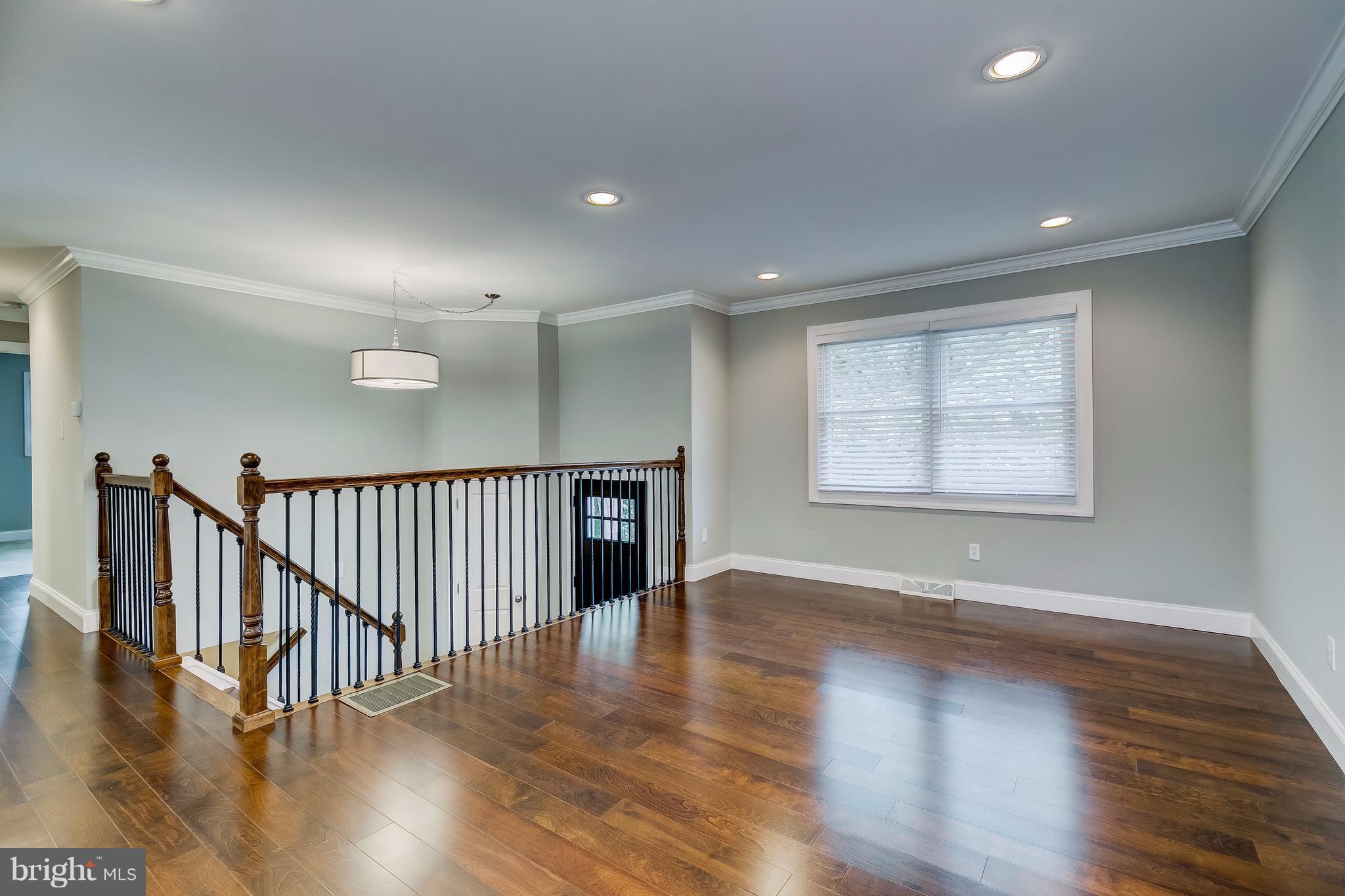 625 Edwards Road Annapolis, MD 21409 - Photo 4 of 30 a view of an empty room with wooden floor and a window