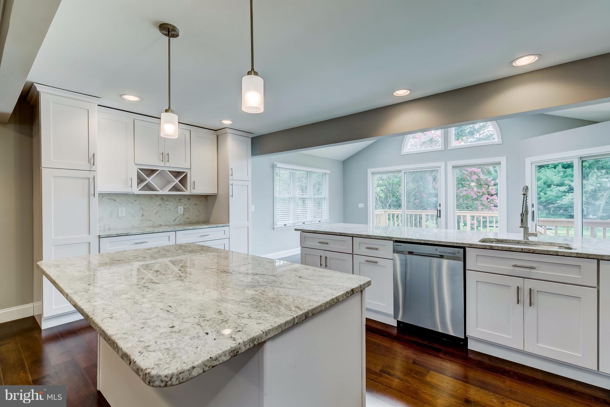 625 Edwards Road Annapolis, MD 21409 - Photo 7 of 30 a kitchen with granite countertop a sink a center island and stainless steel appliances