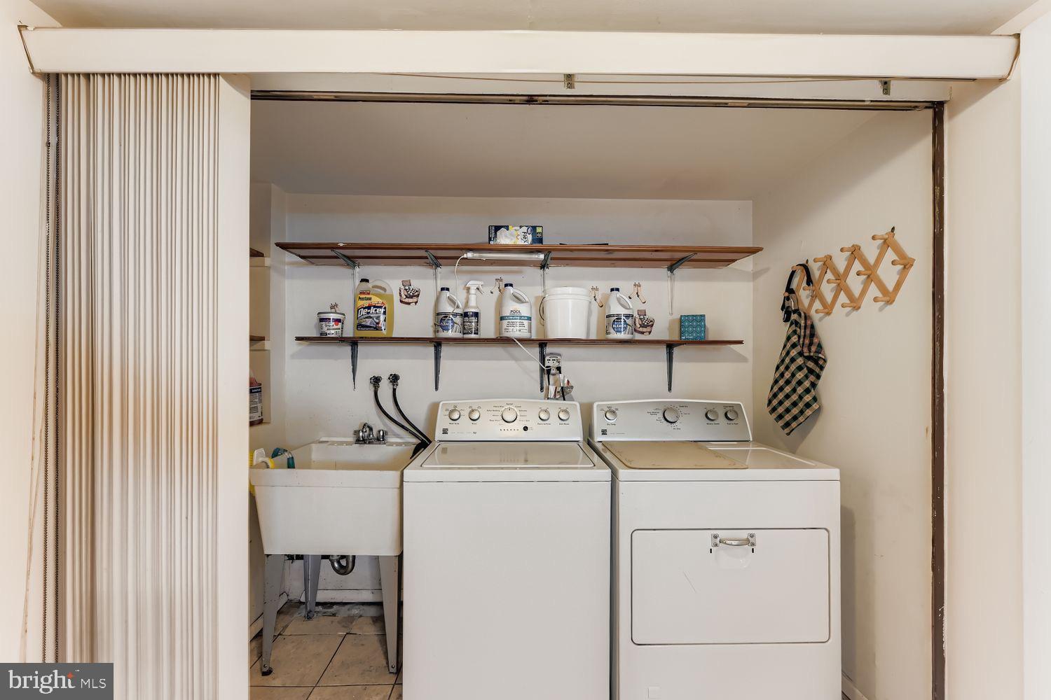 8004 Sagramore Road Rosedale, MD 21237 - Photo 21 of 34 a utility room with dryer and washer