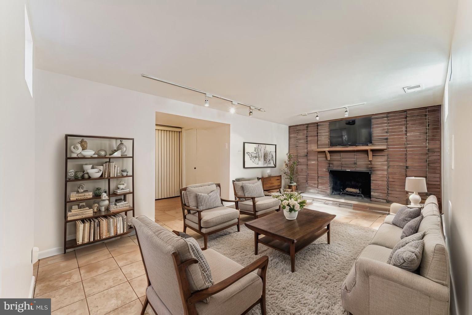 8004 Sagramore Road Rosedale, MD 21237 - Photo 23 of 34 a living room with furniture and a fireplace