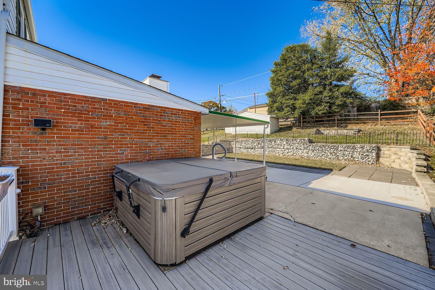 8004 Sagramore Road Rosedale, MD 21237 - Photo 27 of 34 a view of a terrace with wooden floor and outdoor seating