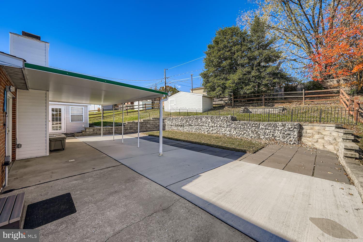 8004 Sagramore Road Rosedale, MD 21237 - Photo 28 of 34 a view of a patio with two chairs and a table