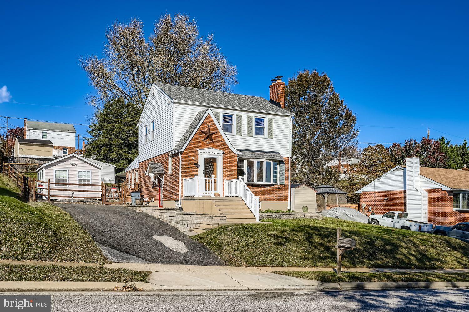 8004 Sagramore Road Rosedale, MD 21237 - Photo 3 of 34 a front view of a house with a yard