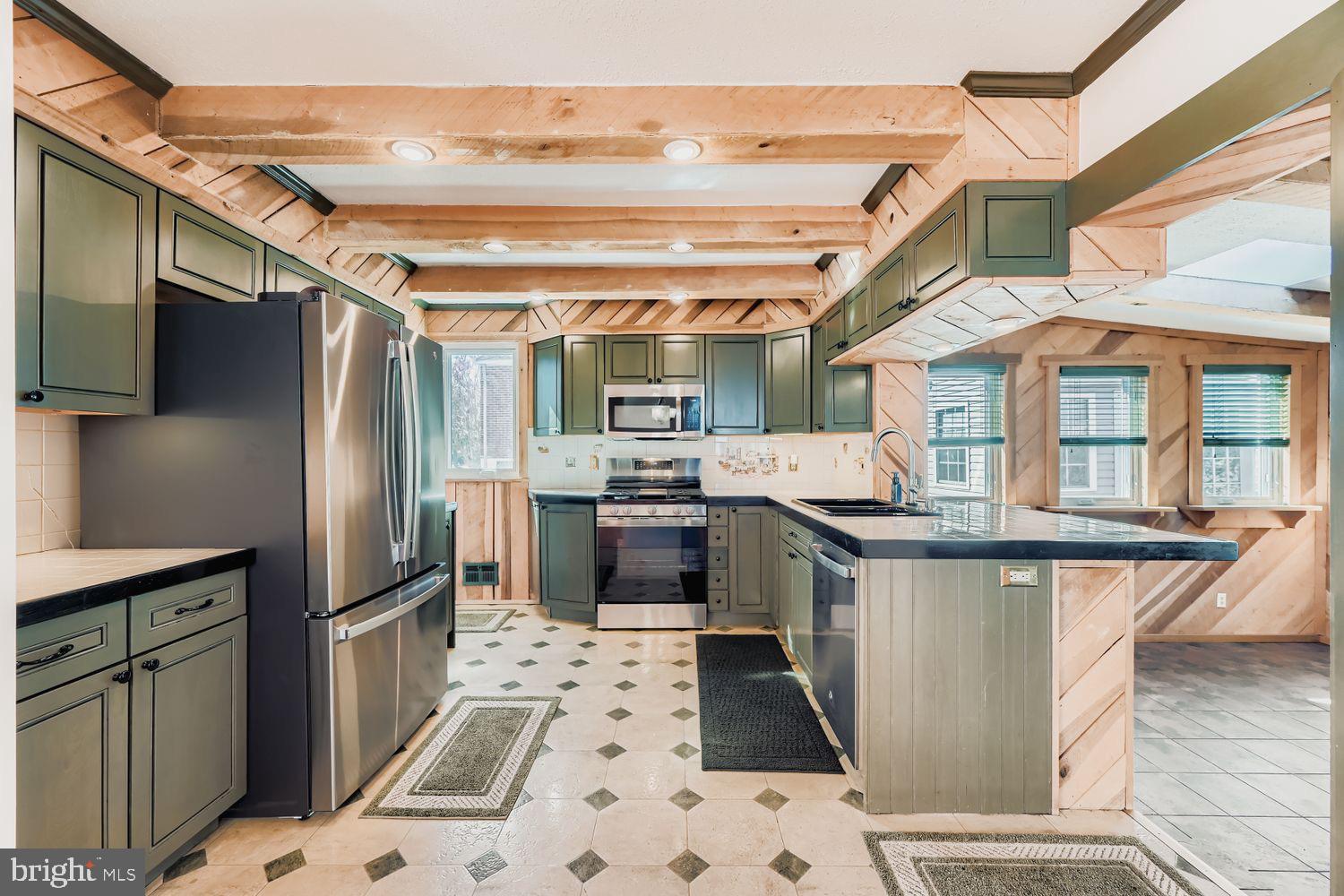 8004 Sagramore Road Rosedale, MD 21237 - Photo 9 of 34 a kitchen with stainless steel appliances granite countertop a stove and a refrigerator