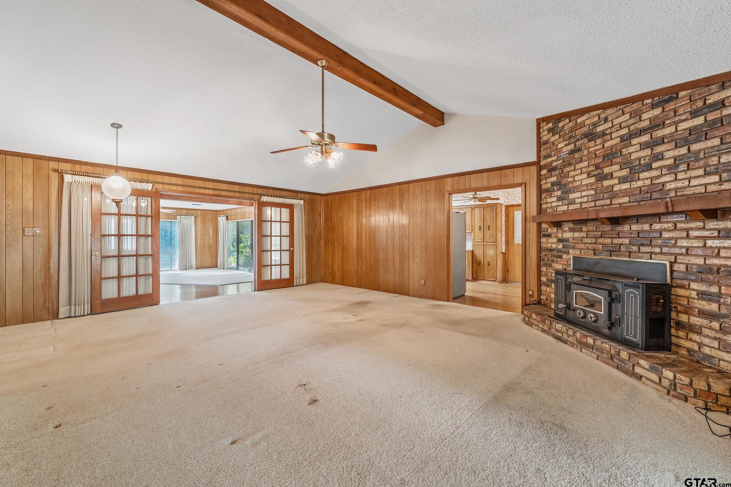 331 Bent Horseshoe Lane Holly Lake Ranch, TX 75765 - Photo 18 of 44 a big room with windows and fireplace