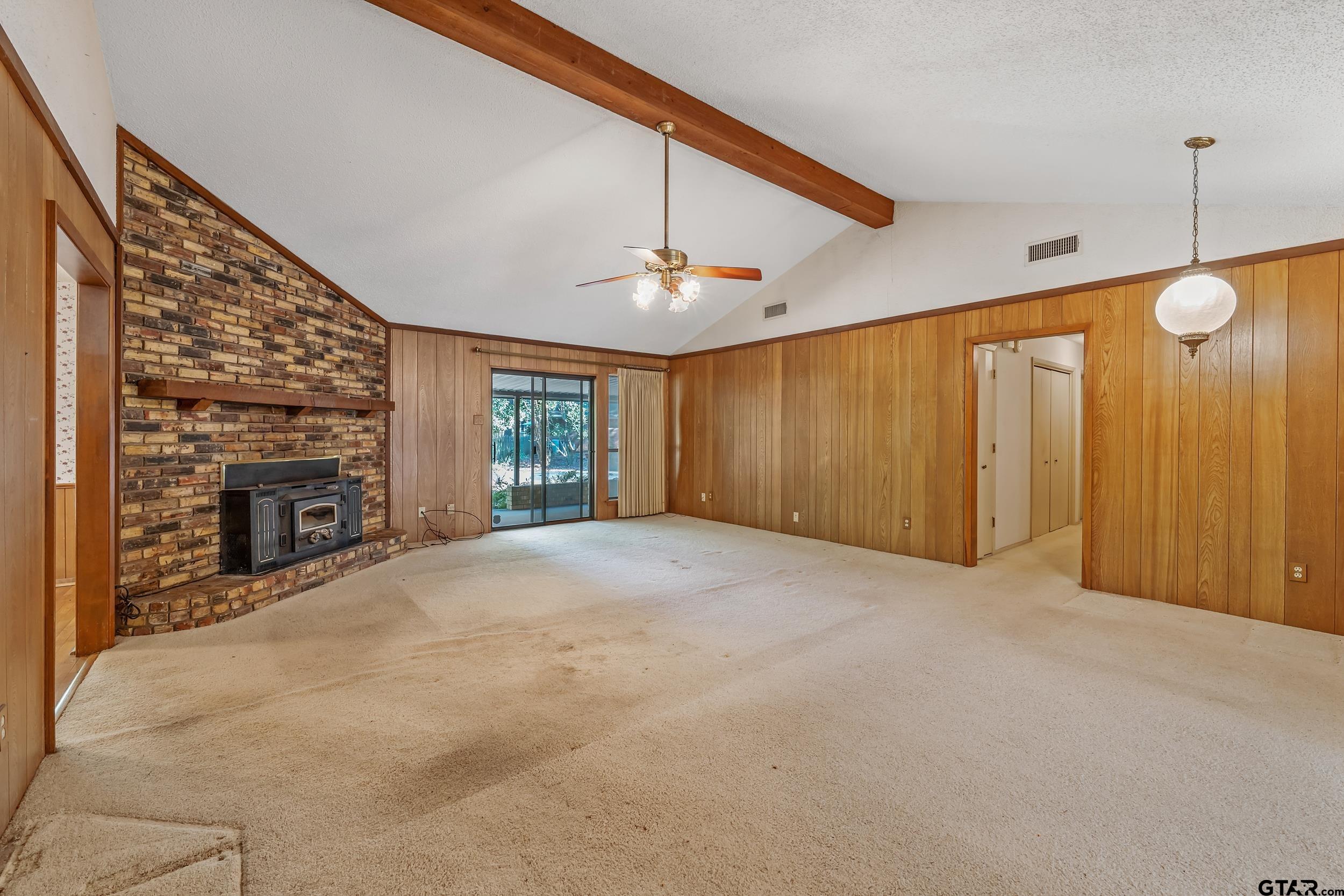 331 Bent Horseshoe Lane Holly Lake Ranch, TX 75765 - Photo 21 of 44 a view of an empty room with a fireplace and a window