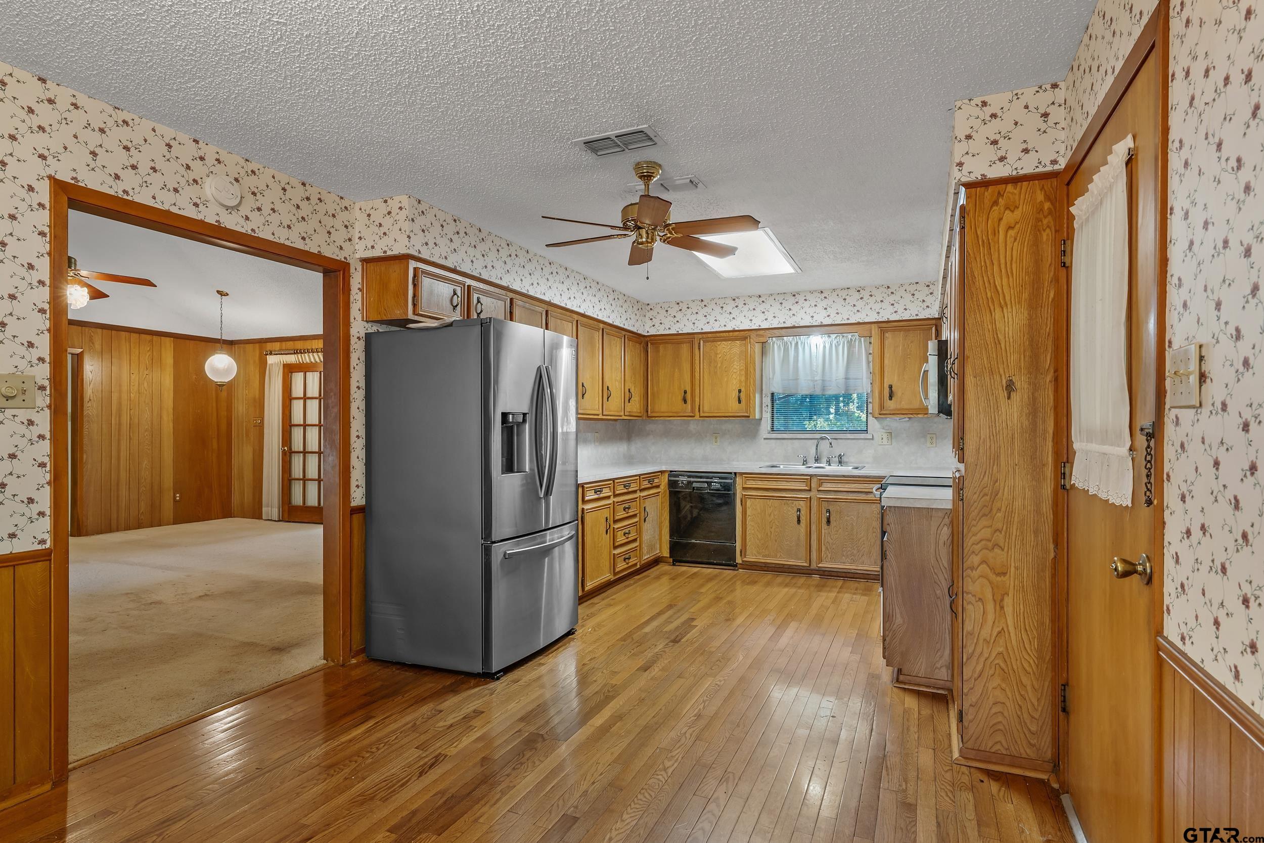 331 Bent Horseshoe Lane Holly Lake Ranch, TX 75765 - Photo 24 of 44 a kitchen with stainless steel appliances a refrigerator and a stove top oven