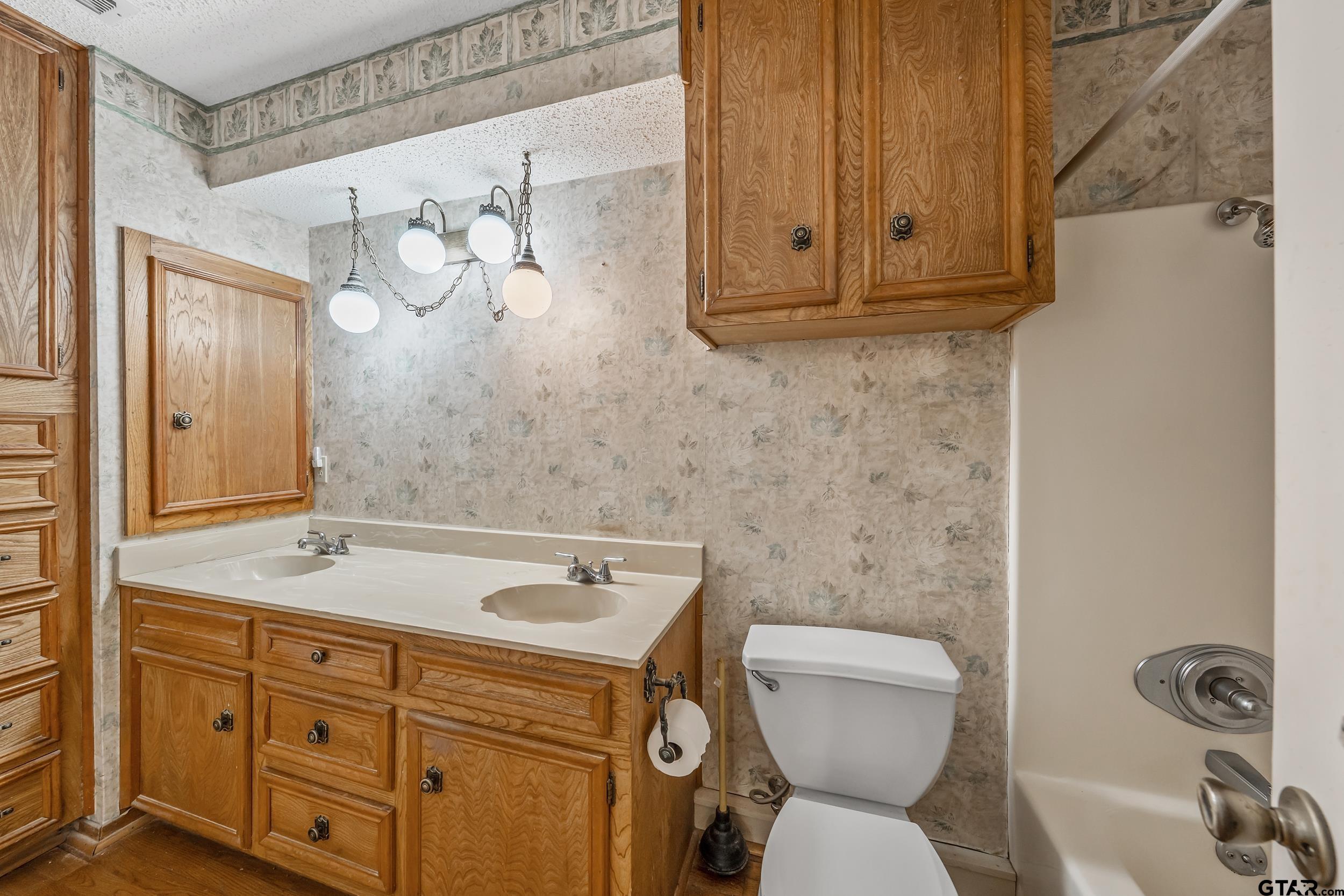 331 Bent Horseshoe Lane Holly Lake Ranch, TX 75765 - Photo 37 of 44 a bathroom with a sink a toilet and shower