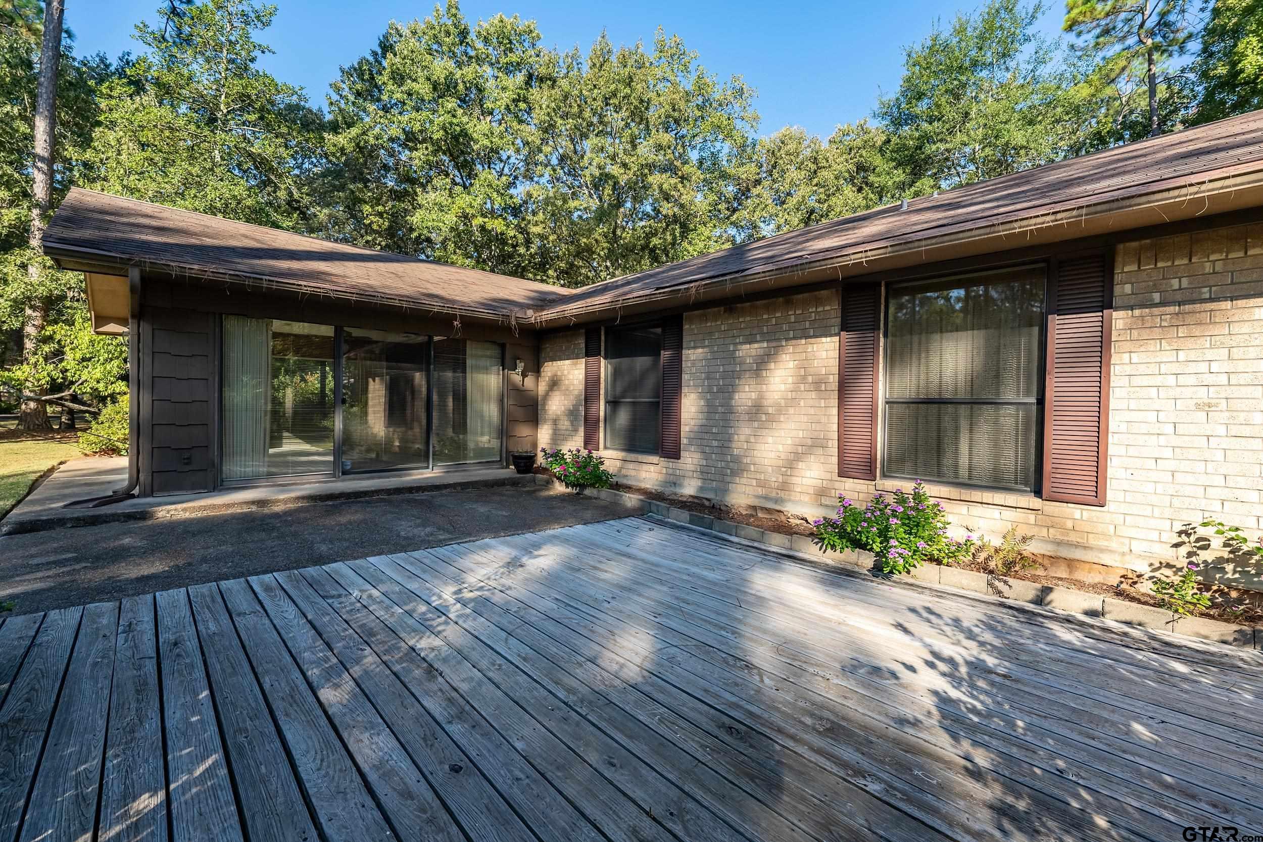 331 Bent Horseshoe Lane Holly Lake Ranch, TX 75765 - Photo 6 of 44 a front view of a house with garden