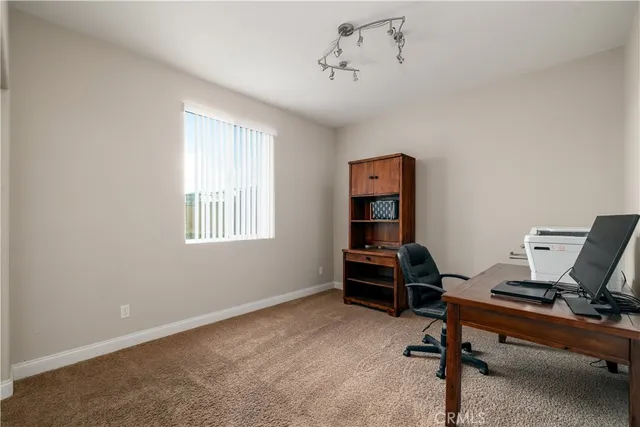 a view of a workspace with furniture