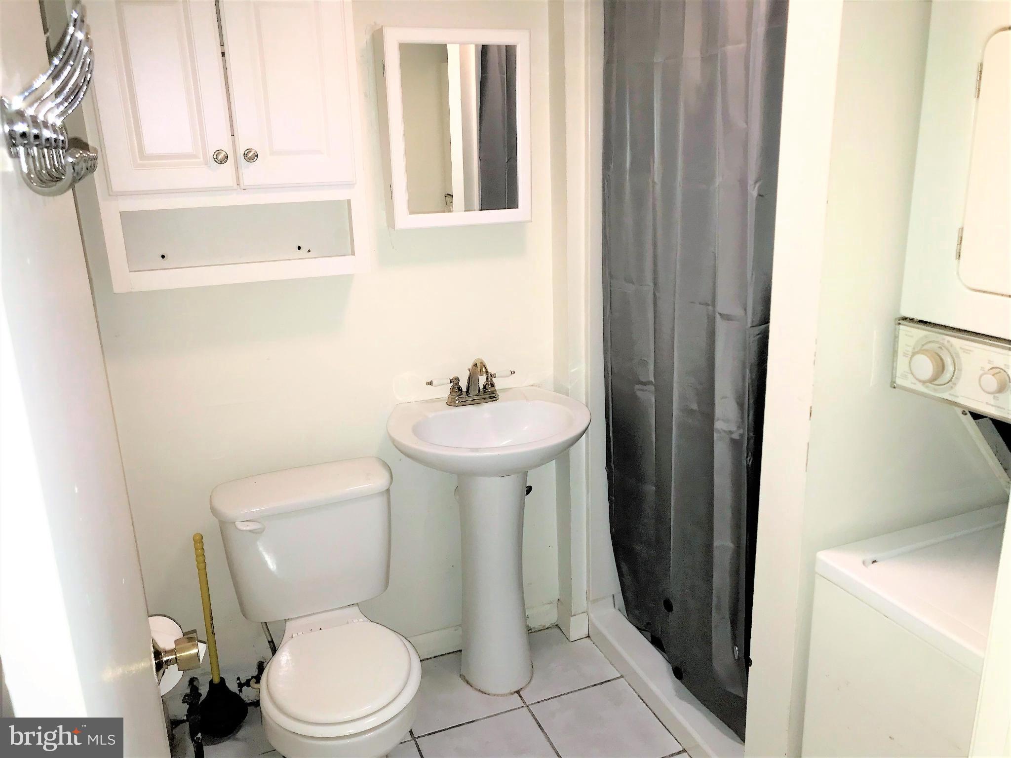 139 Wilson Street Cecilton, MD 21913 - Photo 7 of 10 a white toilet sitting next to a bathroom sink