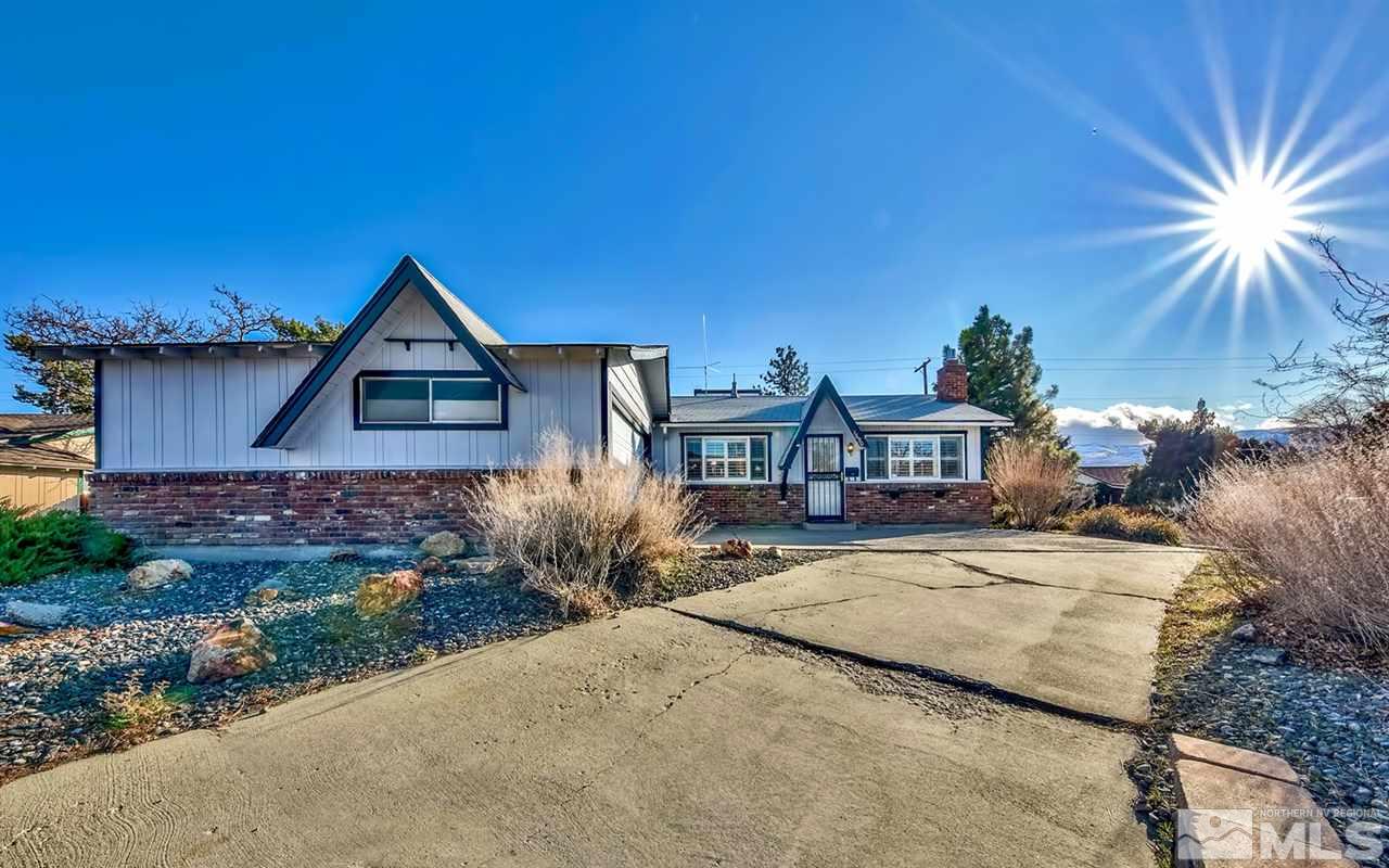 1690 West 6th Street Reno, NV 89503 - Photo 1 of 25 a front view of a house with a yard