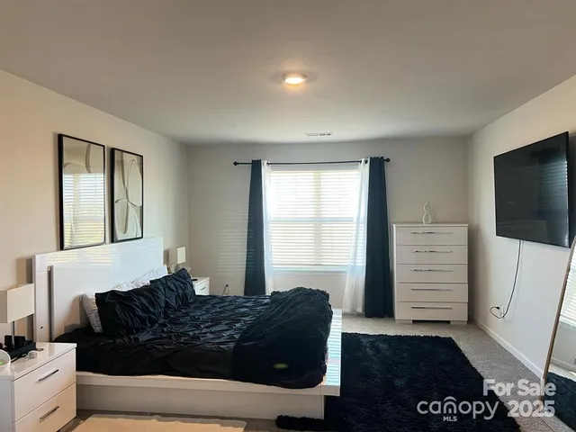 a living room with a couch and a flat screen tv