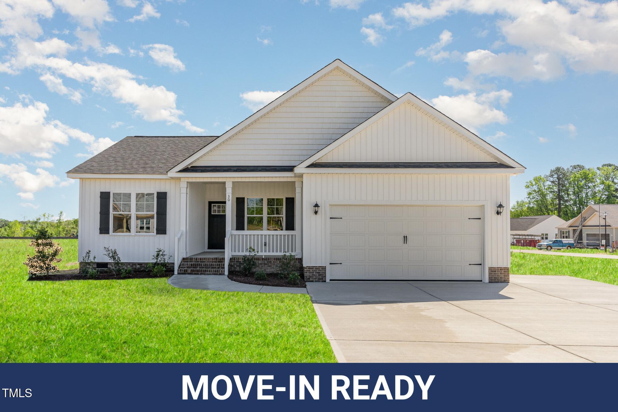 30 Tee Drive Selma, NC 27576 - Photo 1 of 28 a view of an house with backyard and garden