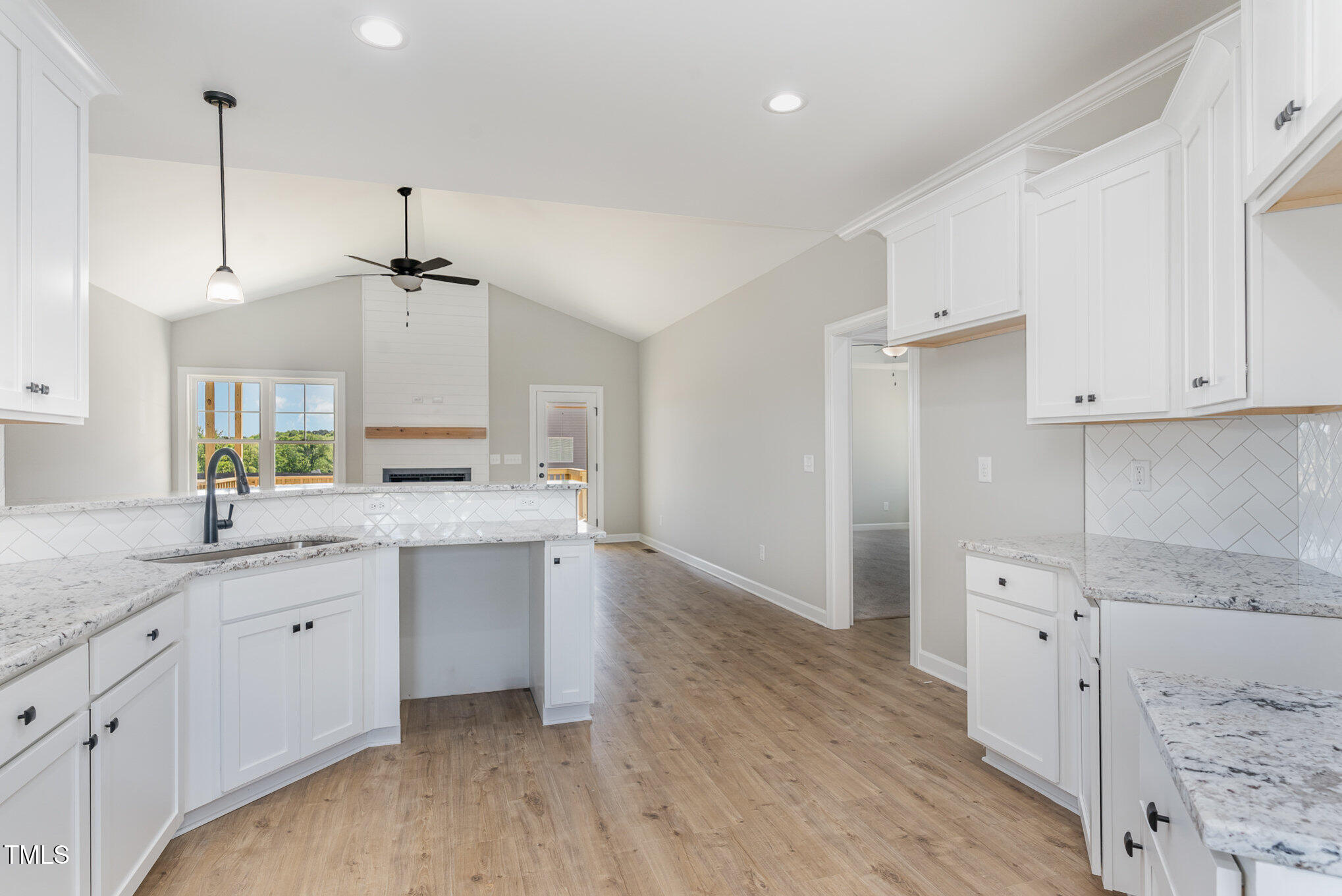 30 Tee Drive Selma, NC 27576 - Photo 14 of 28 a large kitchen with cabinets