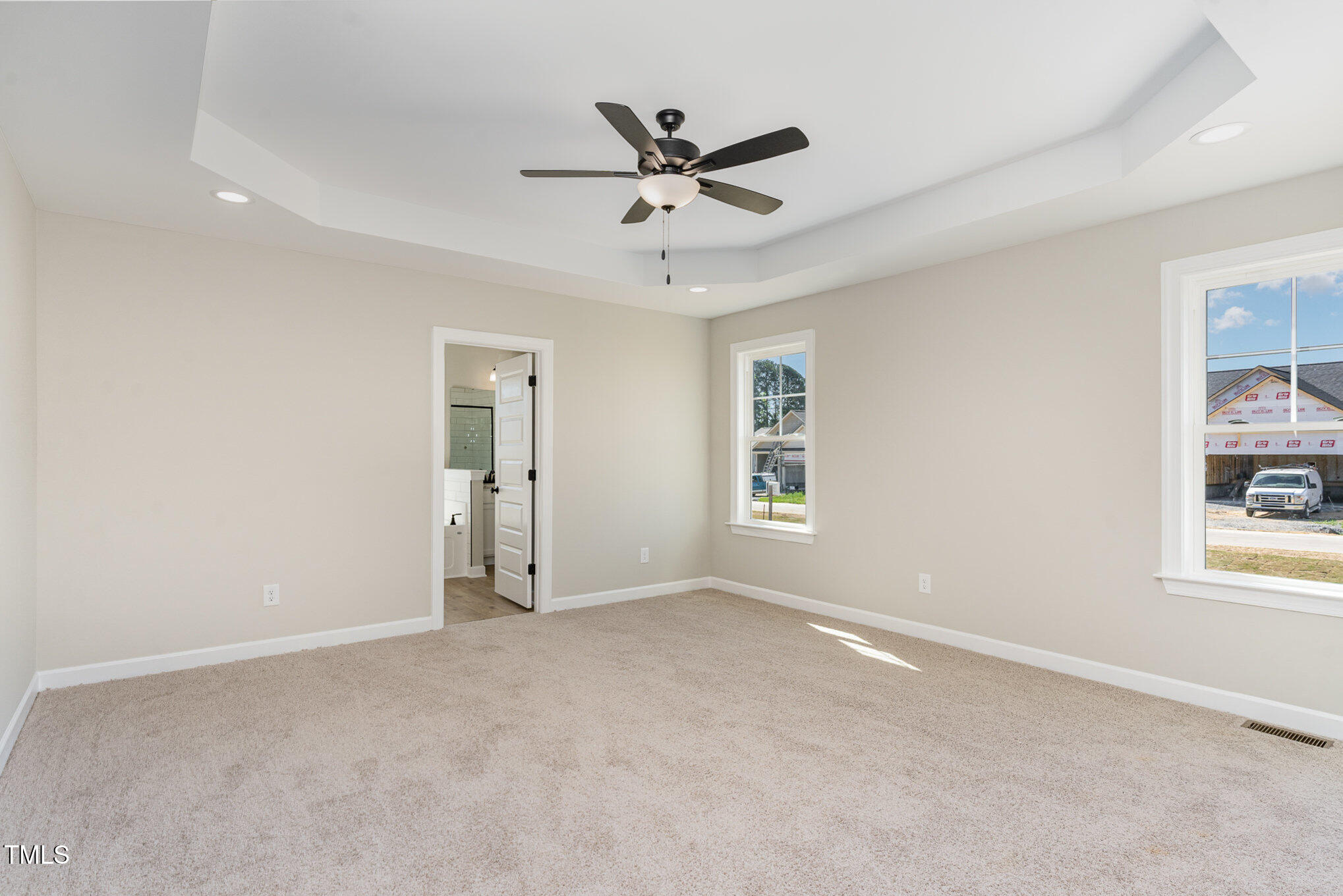 30 Tee Drive Selma, NC 27576 - Photo 17 of 28 a view of a livingroom with a ceiling fan & windows