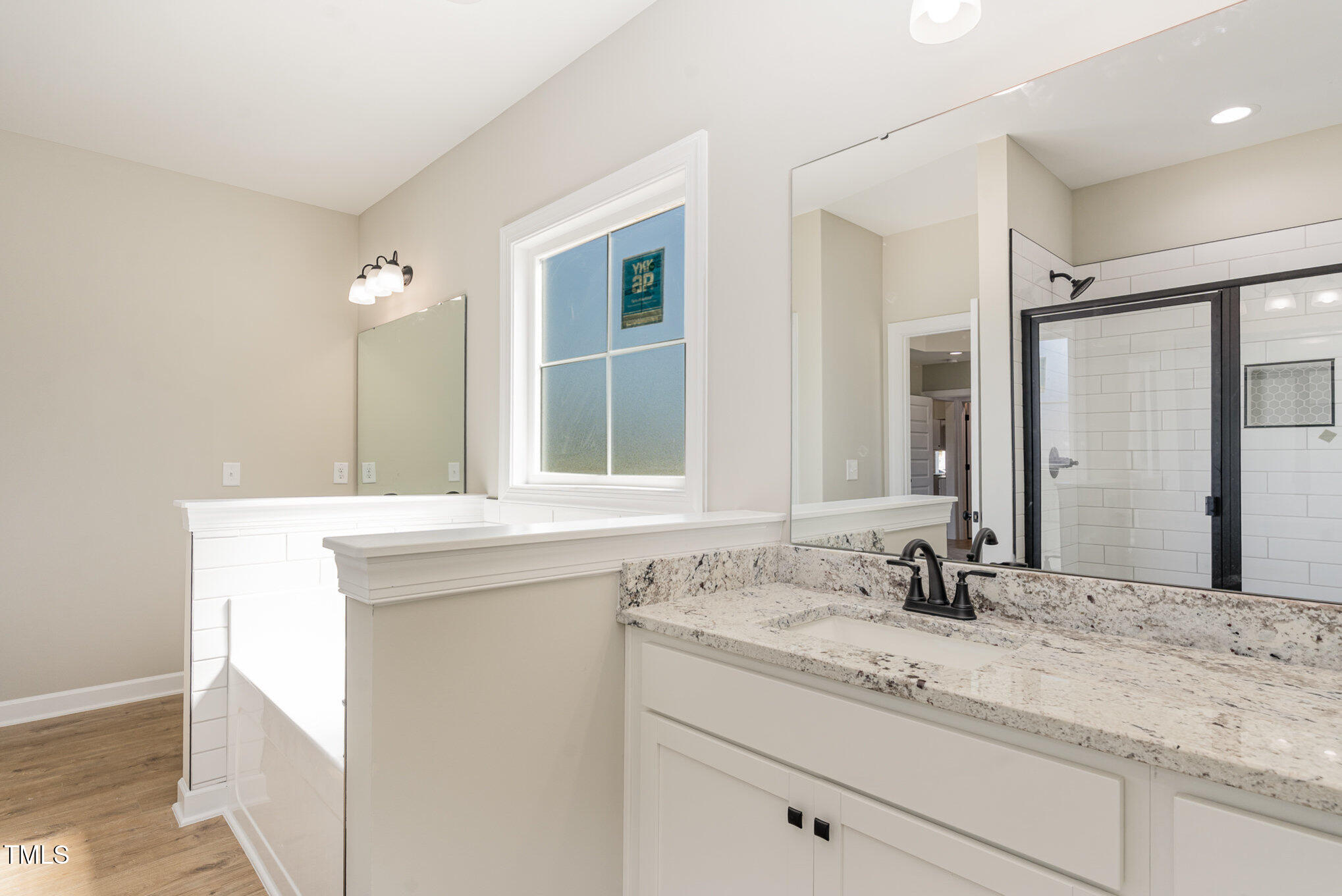 30 Tee Drive Selma, NC 27576 - Photo 19 of 28 a bathroom with a sink and a mirror