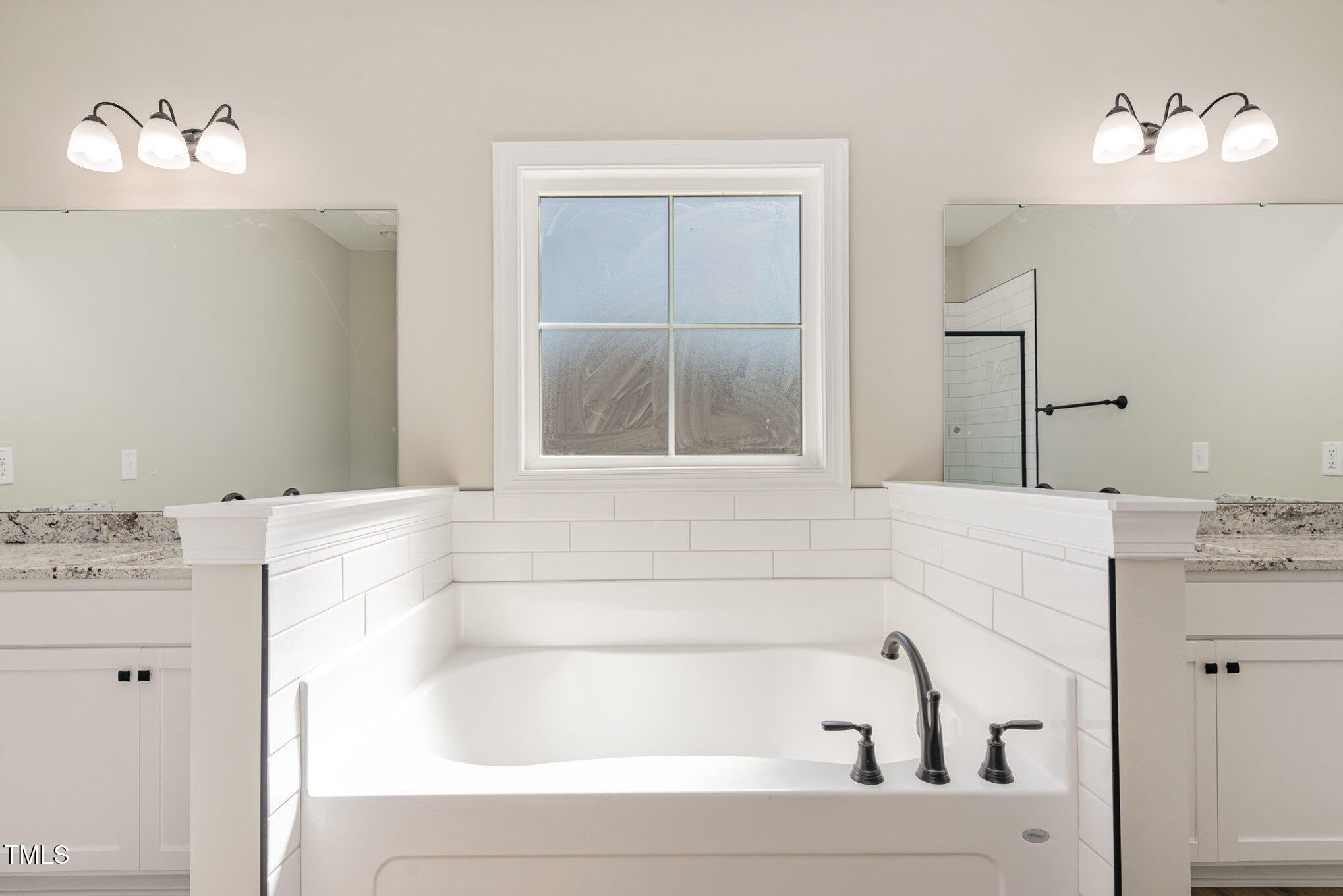 30 Tee Drive Selma, NC 27576 - Photo 20 of 28 a bathroom with a bathtub and a sink