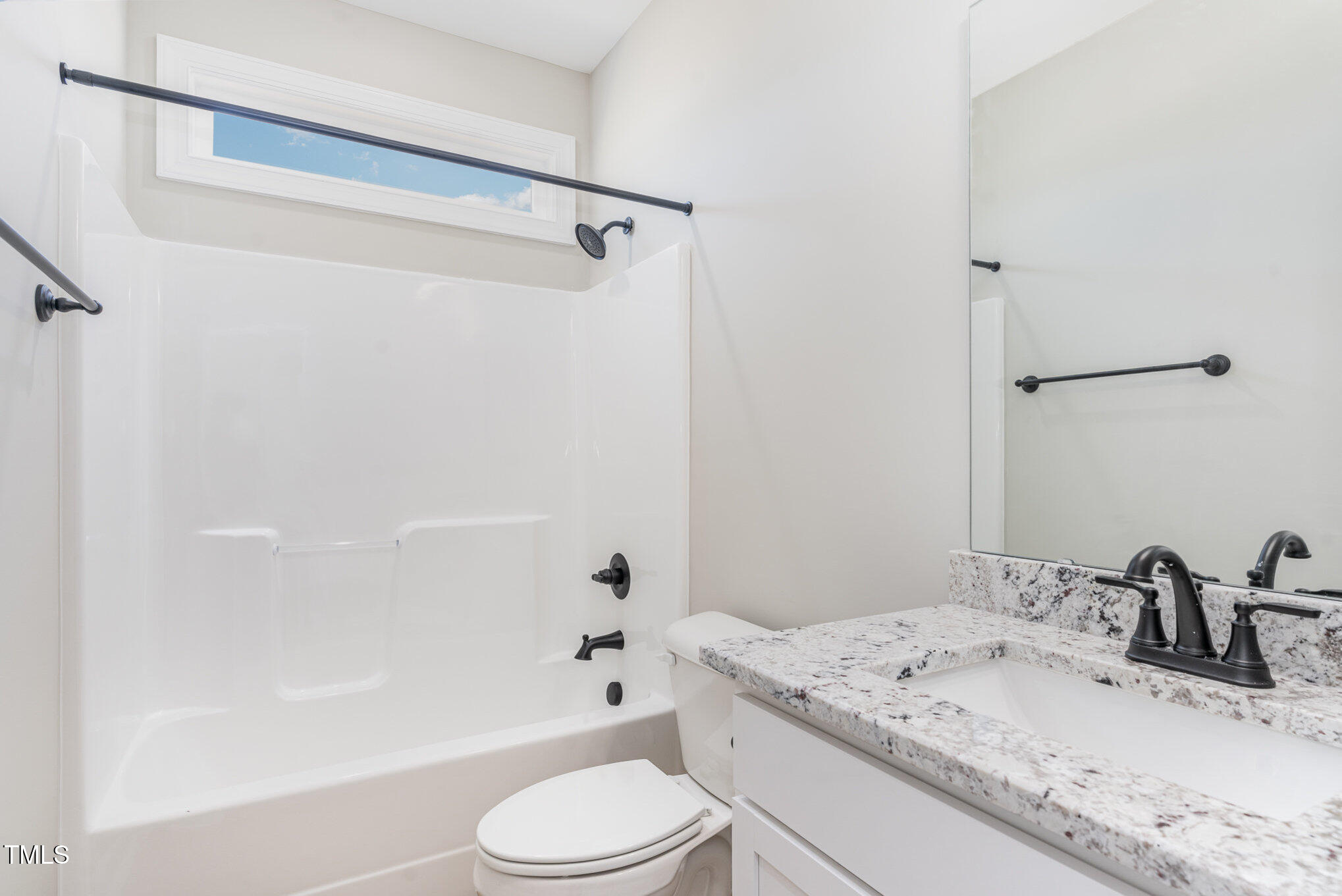 30 Tee Drive Selma, NC 27576 - Photo 24 of 28 a bathroom with a granite countertop sink toilet and shower