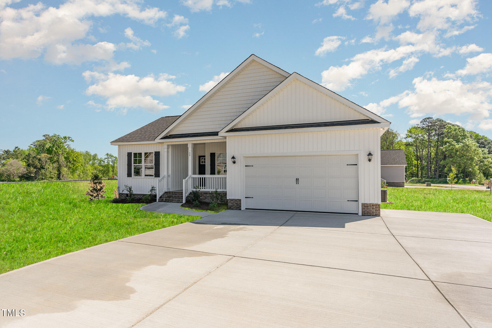 30 Tee Drive Selma, NC 27576 - Photo 3 of 28 a view of a house with a yard